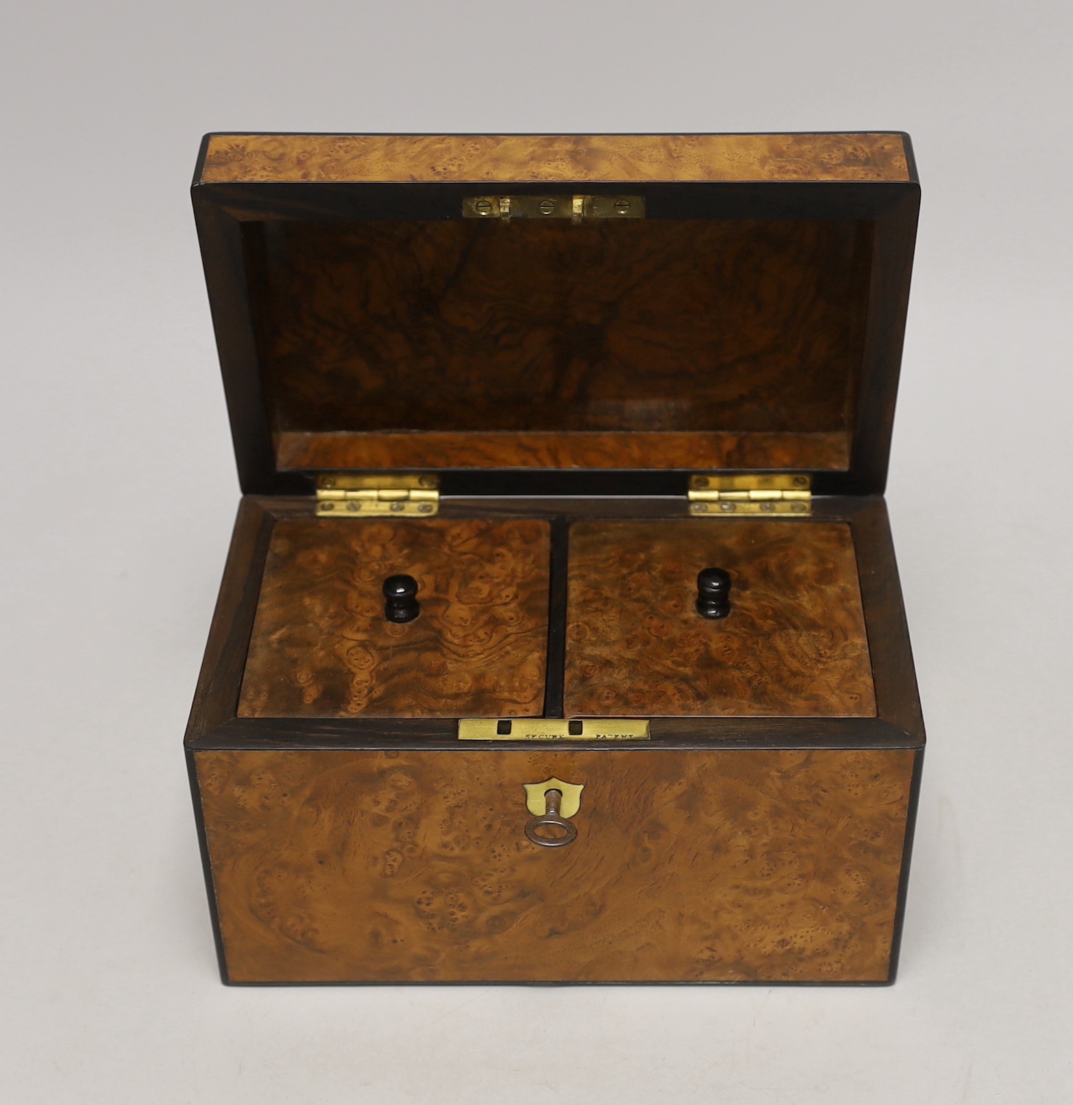 A 19th century burr walnut veneered tea caddy, with divisional interior and internal covers, 20cm wide